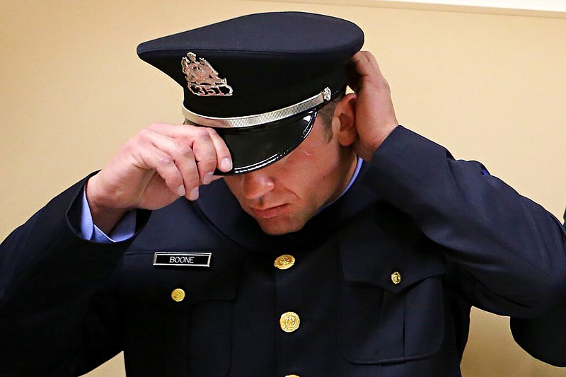 FILE - Then - Officer Dustin Boone adjusts his hat while lining up to prepare to march in to the auditorium for their graduation ceremony from the St. Louis Police academy at Harris-Stowe State University in St. Louis. A federal judge in St. Louis on Monday, Nov 22, 2021, sentenced former St. Louis Police Officer Dustin Boone to one year and one day in prison for an attack that badly injured an undercover colleague. (David Carson/St. Louis Post-Dispatch via AP File)