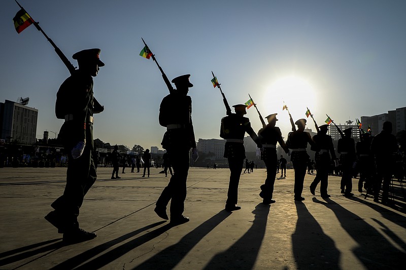 FILE - Ethiopian military parade with national flags attached to their rifles at a rally organized by local authorities to show support for the Ethiopian National Defense Force (ENDF), at Meskel square in downtown Addis Ababa, Ethiopia Sunday, Nov. 7, 2021. United States envoy Jeffrey Feltman said Tuesday, Nov. 23, 2021 that he sees "massive progress" in talks with Ethiopia's warring sides, but he fears it will be outpaced by "alarming" military developments in the yearlong war in Africa's second-most populous country. (AP Photo, File)