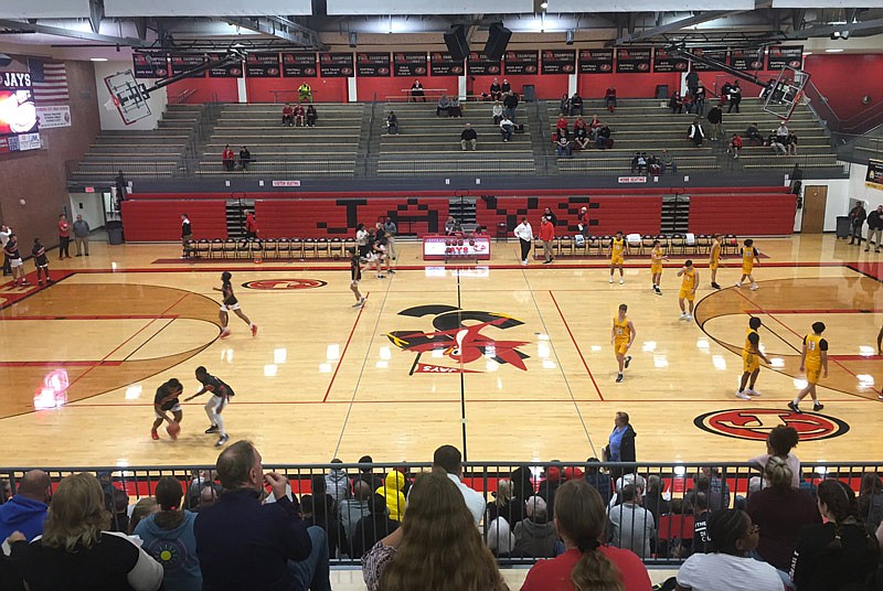 Players warm up Nov. 23, 2021, at Fleming Fieldhouse for the Jefferson City Jays' basketball season opener against Smith-Cotton.