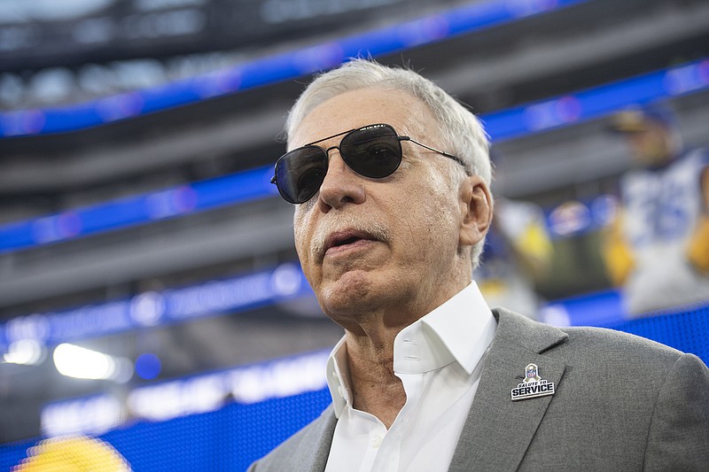 In this Nov. 7 file photo, Rams owner Stan Kroenke walks on the field during a game against the Titans in Inglewood, Calif. The NFL and Kroenke will pay $790 million to settle a lawsuit filed by St. Louis interests regarding the team's relocation to Los Angeles.