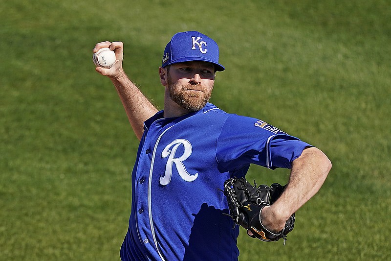 In this Feb. 28 file photo, Royals pitcher Wade Davis throws during the fifth inning of a spring training game against the Rangers in Surprise, Ariz. Davis, a three-time All-Star, is retiring after 13 major league seasons at age 36.