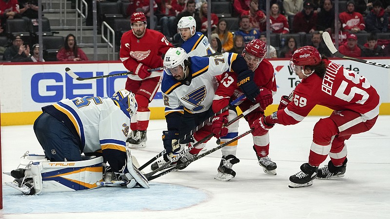Blues goaltender Ville Husso stops a shot by Red Wings left wing Tyler Bertuzzi in the second period of Wednesday night's game in Detroit.