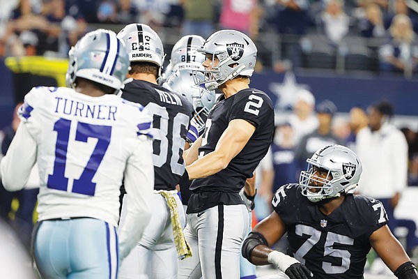 Raiders kicker Daniel Carlson celebrates kicking a game-winning field goal in overtime Thursday to beat the Cowboys in Arlington, Texas.