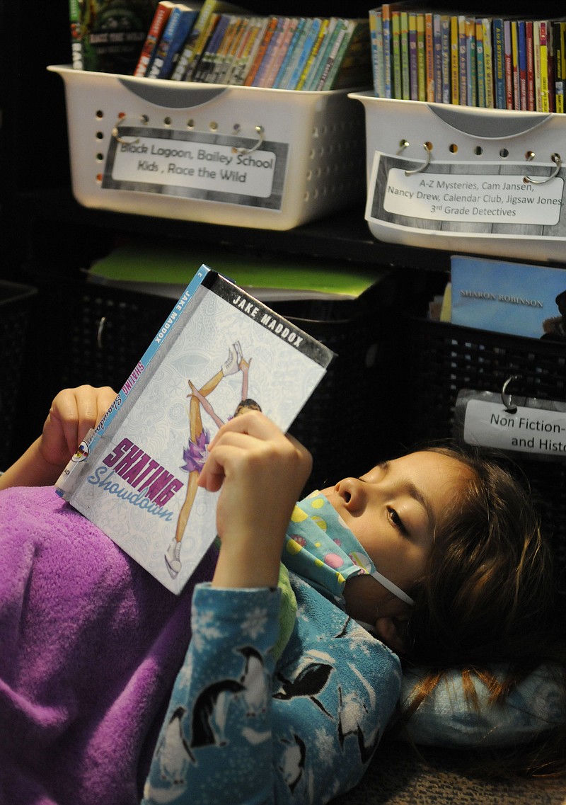 A Belair student reads during Drop Everything and Read Day for the 2020-21 school year. The district has seen progress in reading over the last several years. Photo courtesy of Brittany Ruess.