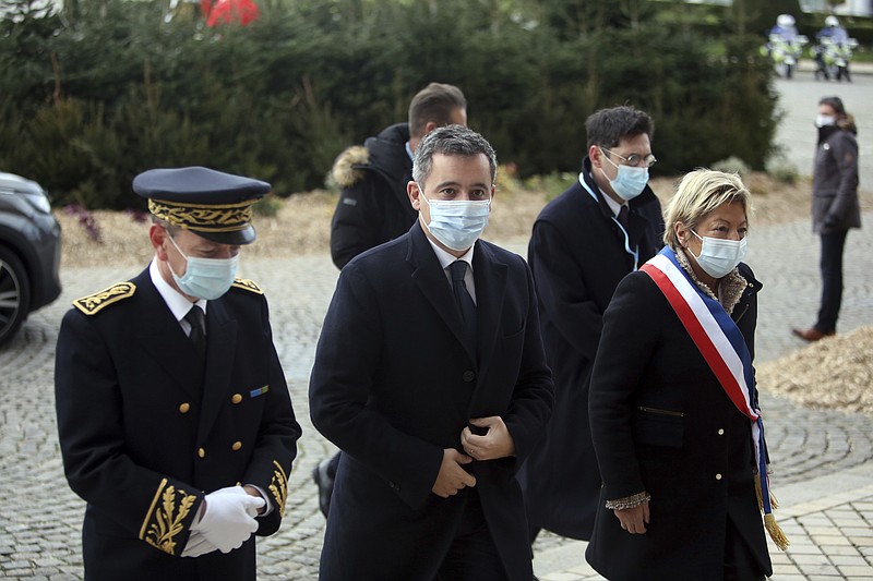 Interior Minister Gerald Darmanin, center, arrives for a meeting with European migration officials, in Calais, northern France, Sunday, Nov. 28, 2021. Top European migration officials are holding an emergency meeting Sunday in the French port of Calais to find ways to better fight migrant smuggling, after 27 people died trying to cross the English Channel to Britain in an overcrowded inflatable boat. (AP Photo/Rafael Yaghobzadeh)