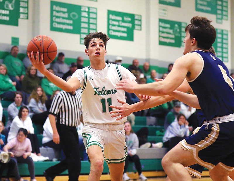 Quinn Kusgen of Blair Oaks drives toward the basket during a game last season against Helias in Wardsville.