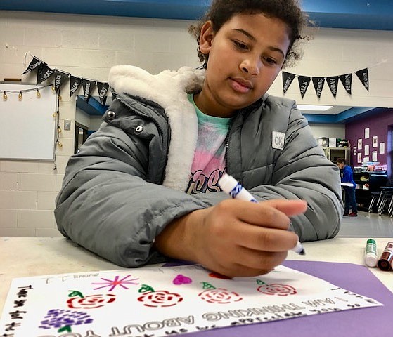 Anniah Woodard, 11, creates a holiday card for a random donor at the Boys & Girls Club of Jefferson City on Tuesday, Nov. 30. All the club's students worked on cards, which are to be distributed among donors.