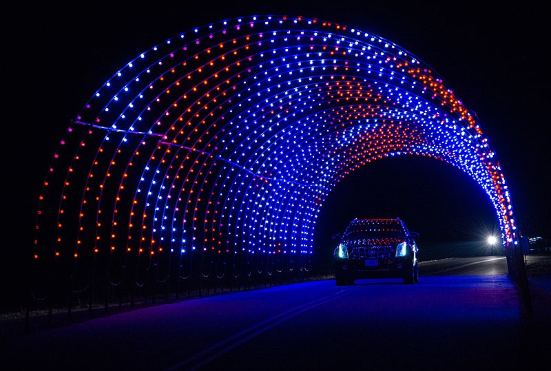 Visitors enjoy driving through this magical light tunnel at the JC Parks' Capital City Festival of Lights at Binder Lake.  (Ken Barnes/News Tribune)