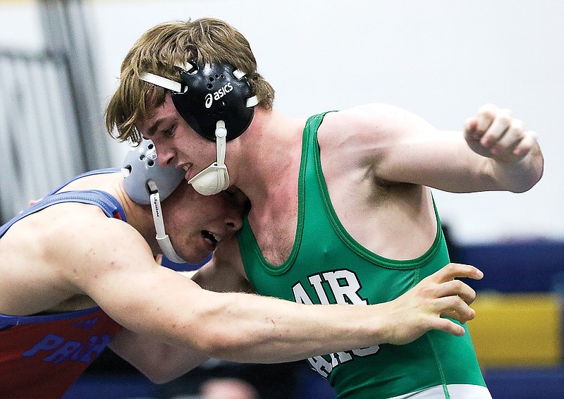 Camden Meeks of Blair Oaks wrestles against Adam Rolwes of Priory in the Class 2 182-pound sectional championship match last season at Rackers Fieldhouse.