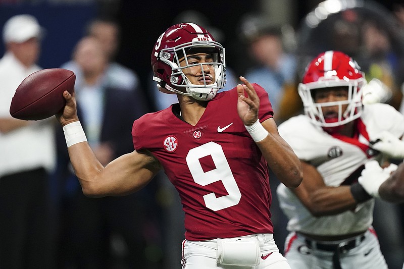 Alabama quarterback Bryce Young passes in the pocket against Georgia during the first half of the Southeastern Conference championship game Saturday in Atlanta.