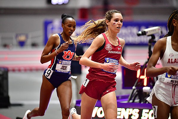 Arkansas' Katie Izzo (front) runs during the SEC Indoor Championships on Friday, Feb. 26, 2021, in Fayetteville.