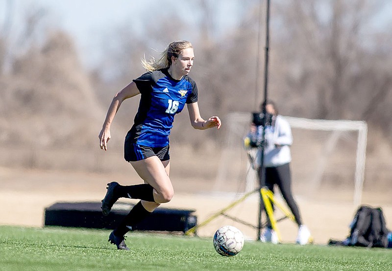 Photo courtesy of David Beach John Brown freshman Lauren Walter runs with the ball during Tuesday’s game against Southwestern Christian at Titan Sports and Performance Center in Tulsa, Okla. Walter scored three goals at JBU defeated Southwestern Christian 6-1.