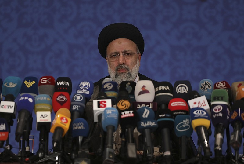 FILE - This Monday, June 21, 2021 photo shows Iran's new President-elect Ebrahim Raisi during a news conference in Tehran, Iran. Iran said Tuesday, June 22, that several state-linked news websites have been seized by the U.S. government under unclear circumstances. While there was no immediate acknowledgement of the seizures from American authorities, it comes amid the wider heightened tensions between the U.S. and Iran over Tehran's now-tattered nuclear deal with world powers. (AP Photo/Vahid Salemi, File)