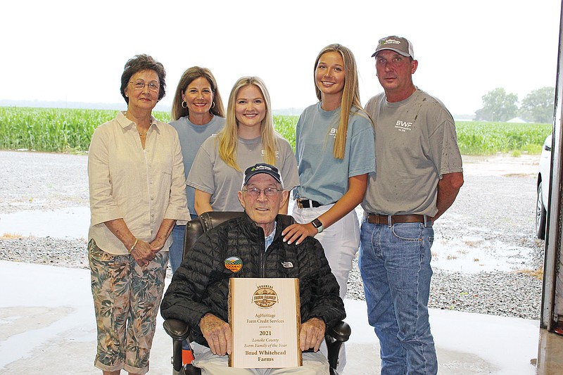Brad Whitehead Farms was named the 2021 Lonoke County Farm Family of the Year. Members of the family are, standing, second from left, Jill Whitehead, Mallory Whitehead, Lauren Whitehead and Brad Whitehead. Also shown are Brad’s parents, Karen Whitehead, standing, far left, and William Whitehead, sitting in front.