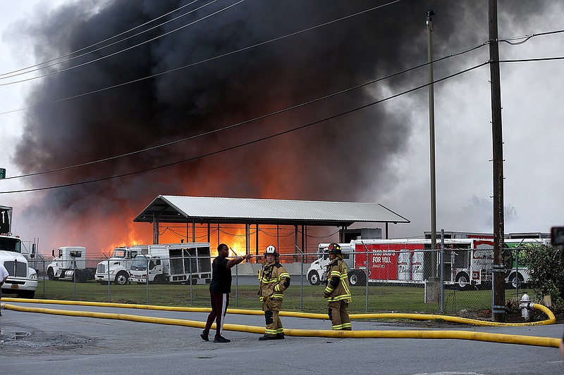 Little Rock firefighters battle a fire that started at Goldman Recycling and has spread to other buildings on Tuesday, Sept. 21, 2021, in Little Rock. (Arkansas Democrat-Gazette/Thomas Metthe)