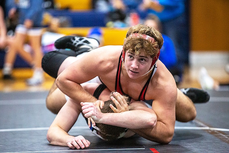 Michael Friederich of Jefferson City keeps his opponent on the mat during their 195-pound match Saturday in the Missouri Duals at the Helias Gym. (Ethan Weston/News Tribune)