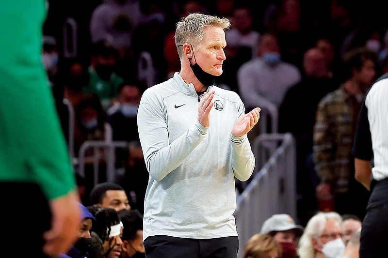 Warriors coach Steve Kerr claps for his team during last Friday’s game against the Celtics in Boston. (Associated Press)