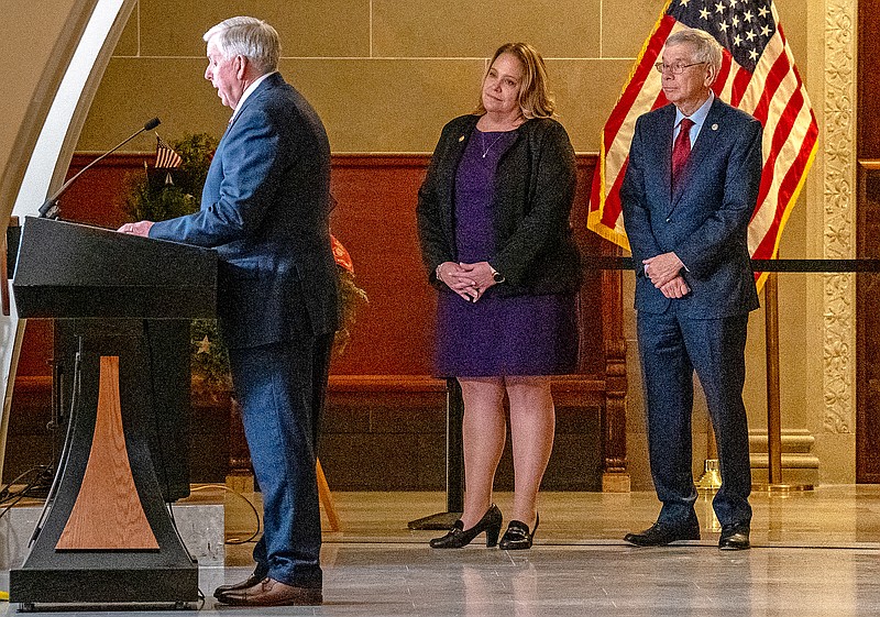 New Department of Mental Health Director Valerie Huhn and new Department of Revenue Director Wayne Wallingford listen Wednesday as Gov. Mike Parson speaks at a news conference at the Missouri state Capitol in Jefferson City. (Ethan Weston/News Tribune)