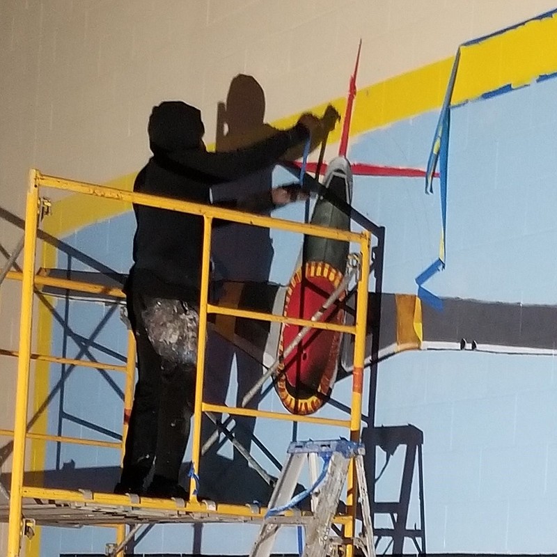 Robert “Brandon” Maddox worked on two murals in December for the Sgt. Elga Lee Roberts Jefferson County Veterans Service Office. (Special to The Commercial)