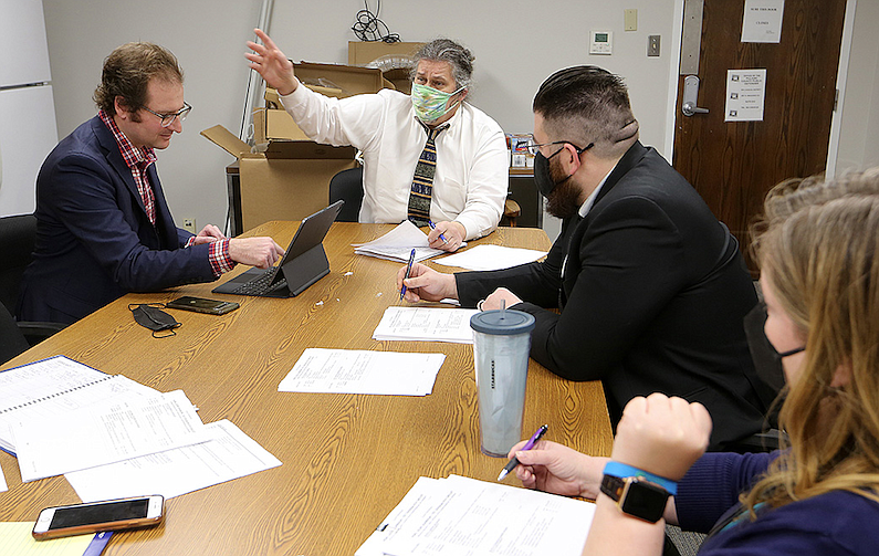 Public defender Lou Marczuk (left center) leads a pretrial conference with other public defenders on Wednesday, Feb. 2, 2022, at the Pulaski County Administration building in Little Rock. 
(Arkansas Democrat-Gazette/Thomas Metthe)