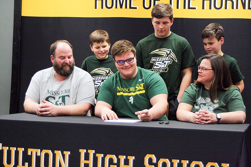 Fulton senior Curtis Humphreys signs his letter of intent to play football for Missouri S&T on Monday at the Fulton High School library. The four-year starting offensive lineman was an all-North Central Missouri Conference player three years and an all-district player two years for the Hornets. (Jeremy Jacob/Fulton Sun)