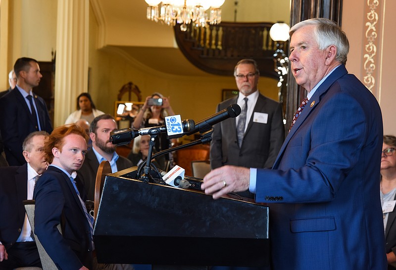 Gov. Mike Parson talks to the media following Day at the Capitol activities, which traditionally include a lunch hosted by the Missouri Press Association in the Governor's Mansion.
