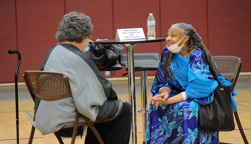 Mentha’Munirah Bolton-Bakari, right, talks to Karen Jones as part of the “Talking Books” program Monday at the First United Methodist Church in downtown Jefferson City. (Shaun Zimmerman/News Tribune)
