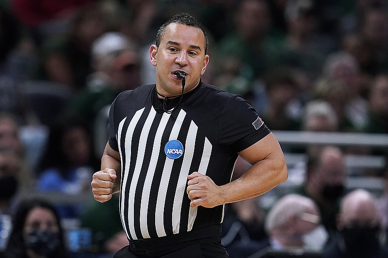 Referee Larry Scirotto runs up court during the second half of Thursday's NCAA Tournament game between Colorado State and Michigan in Indianapolis. (Associated Press)