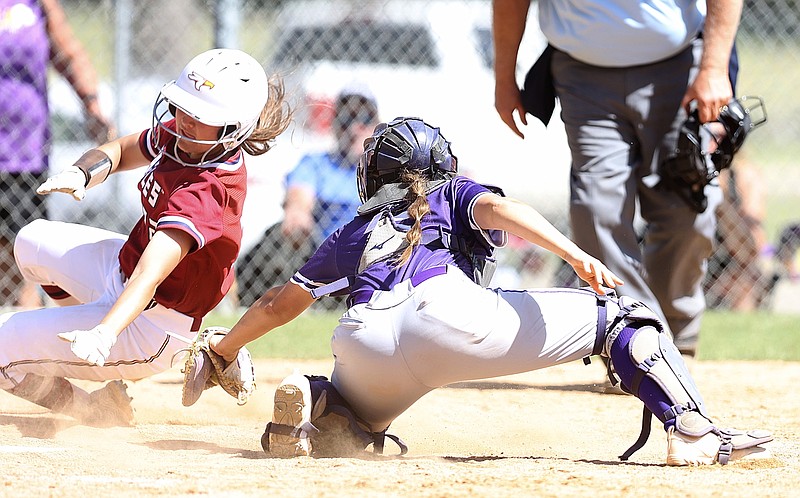 Texas A&M University-Texarkana's  Baylee Stautzenberger tries to avoid getting tagged out during Saturday's Game 1 at Spring Lake Park in Texarkana, Texas. (Photo by JD)