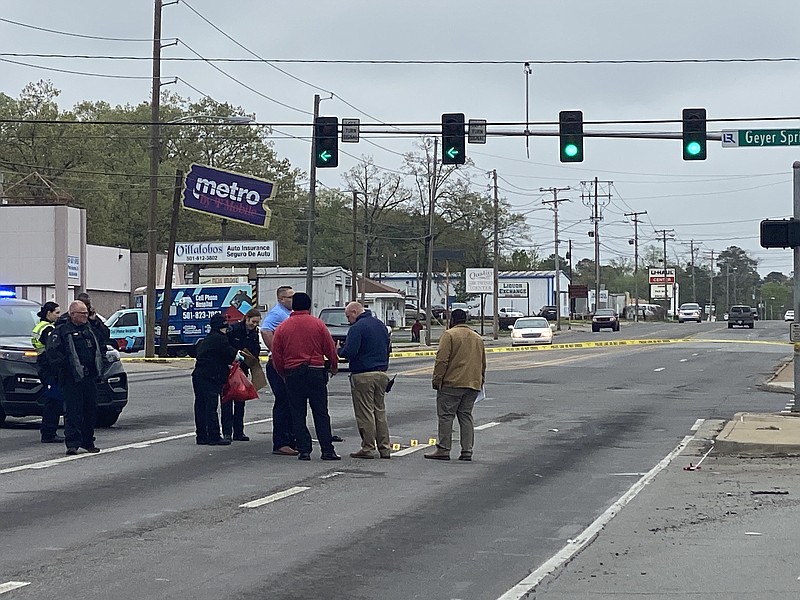 The Little Rock Police Department investigates the scene of a homicide Sunday, April 17, 2022, at the intersection of Geyer Springs and Baseline roads. (Arkansas Democrat-Gazette/Staci Vandagriff)