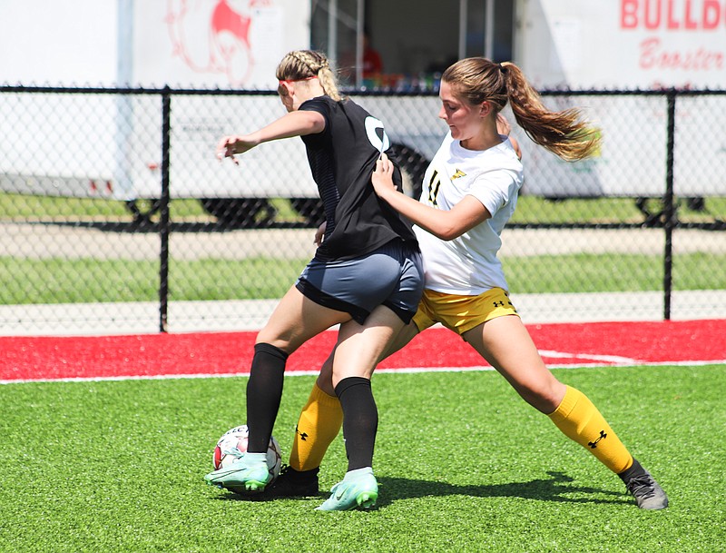 Fulton sophomore Haley Langdon fights for possession of the ball Saturday in the Lady Hornets’ 9-0 district quarterfinal loss to Southern Boone. (Courtesy of Jamie Danuser)