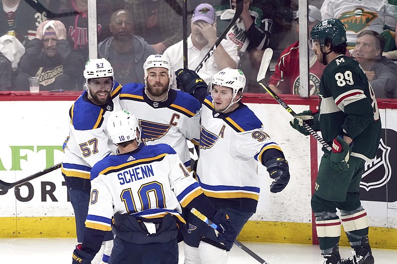 Ryan O'Reilly (center) is congratulated by Blues teammates after scoring a goal off Wild goalie Marc-Andre Fleury in the first period of last Tuesday's Game 5 in a Stanley Cup first-round playoff series in St. Paul, Minn. (Associated Press)