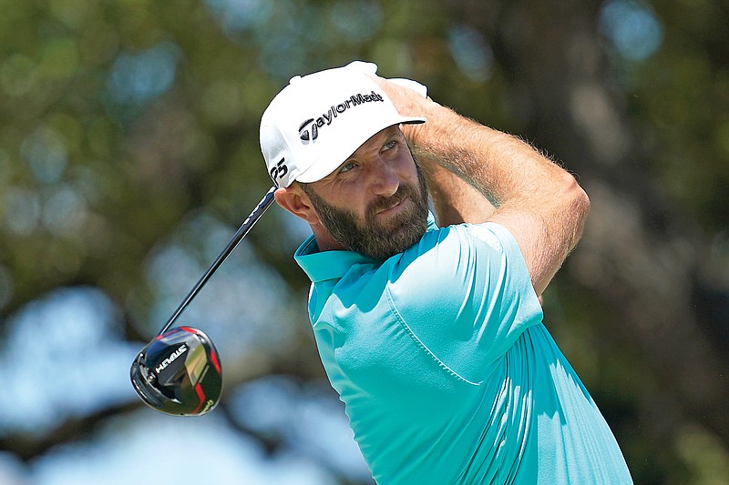 In this March 23 file photo, Dustin Johnson watches his tee shot on the first fairway in the first round of the Dell Technologies Match Play Championship in Austin, Texas. (Associated Press)