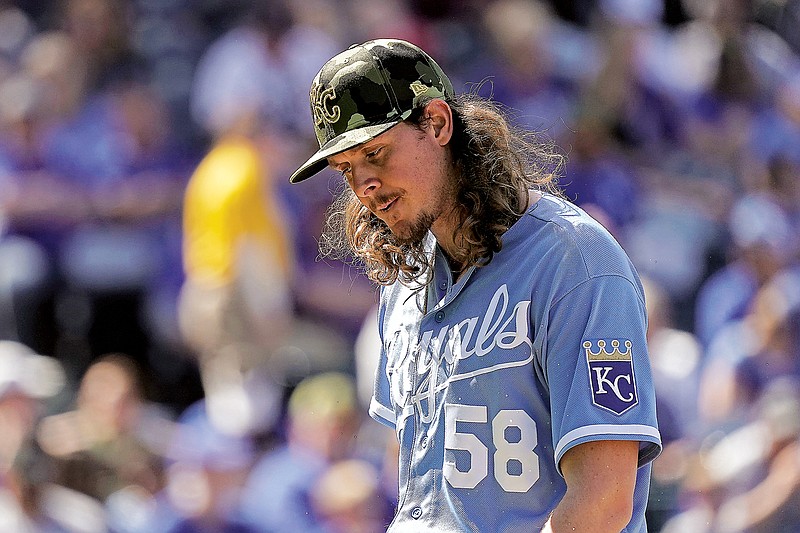 Royals relief pitcher Scott Barlow walks to the dugout after being taken out in the eighth inning of Sunday afternoon’s game against the Twins at Kauffman Stadium in Kansas City. (Associated Press)