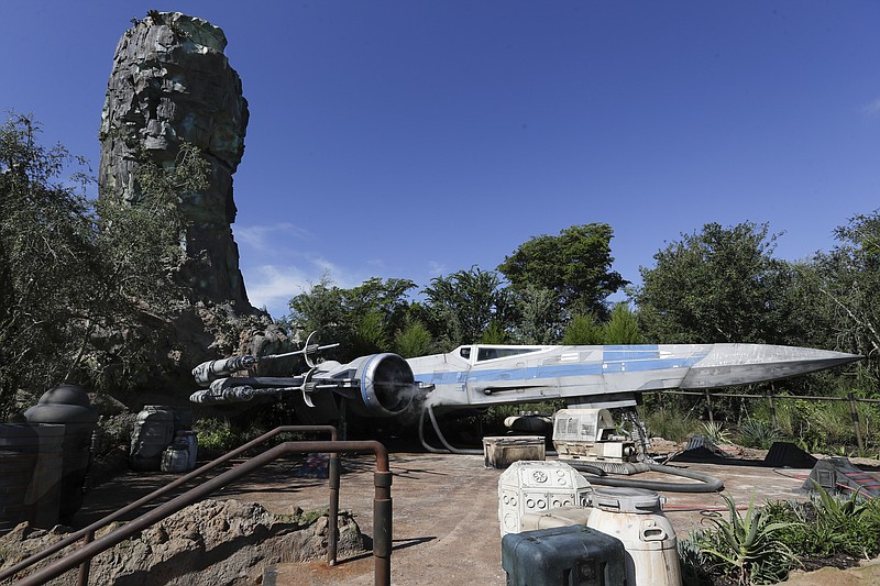 The X-Wing ship stands ready for flight at a display during a preview of the Star Wars themed land, Galaxy's Edge in Hollywood Studios at Disney World, Tuesday, Aug. 27, 2019, in Lake Buena Vista, Fla. (AP Photo/John Raoux)
