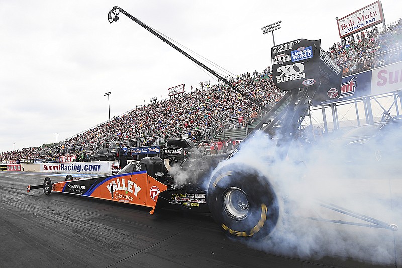 In this photo provided by the NHRA, Top Fuel's Mike Salinas wins for the fourth time of the season in his dragster Sunday at the Summit Racing Equipment NHRA Nationals at Summit Racing Equipment Motorsports Park in Norwalk, Ohio. (Marc Gewertz/NHRA via the Associated Press)