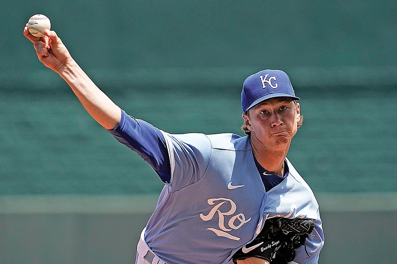 Royals pitcher Brady Singer throws the ball to the plate during the first inning of Sunday afternoon's game against the Athletics in Kansas City. (Associated Press)