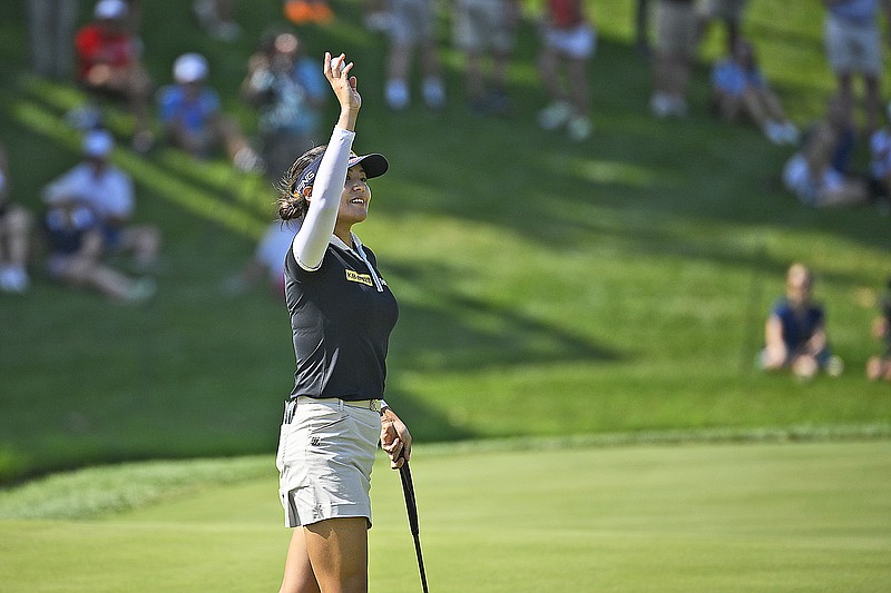 In Gee Chun waves to the gallery Sunday after winning the KPMG Women's PGA Championship at Congressional Country Club in Bethesda, Md. (Associated Press)