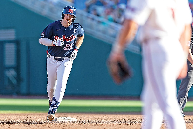 Mississippi’s Tim Elko rounds the bases after hitting a home run during the first inning of last Monday’s College World Series game against Arkansas in Omaha, Neb. (Associated Press)