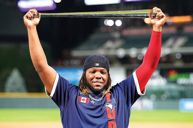 In this July 13, 2021, file photo, Vladimir Guerrero Jr. of the Blue Jays holds the MVP trophy after the MLB All-Star Game in Denver. In all, more than two dozen major league offspring are on American League or National League rosters this season. (Associated Press)