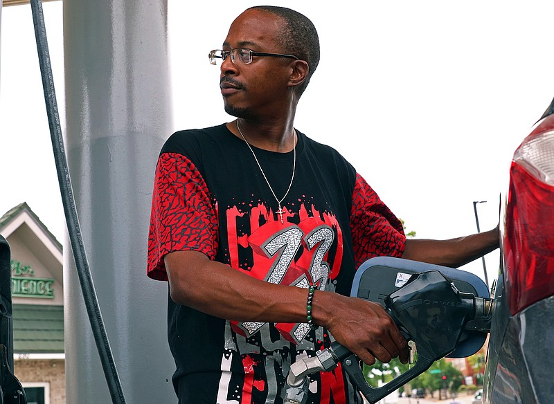 Richard Patton fills up his car with gas on Thursday, July 7, 2022, at Phillips 66 Gas Station on McCarthy St.