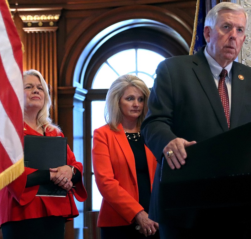 Gov. Mike Parson holds a press conference on the worsening drought conditions. Standing behind Parson Department of Conservation Director Sara Parker Pauley (left) and Department of Agriculture Director Chris Chinn.