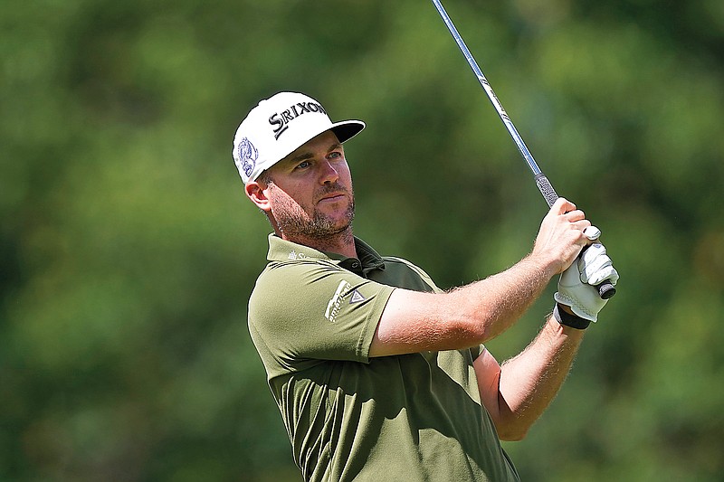 Taylor Pendrith watches his drive off the ninth tee during Friday’s second round of the Rocket Mortgage Classic in Detroit. (Associated Press)