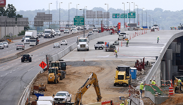 Construction workers continue work on the new Interstate 30 bridge crossing the Arkansas River on Thursday, Aug. 4, 2022, in Little Rock. The bridge is part of the 30 Crossing project. 
(Arkansas Democrat-Gazette/Thomas Metthe)