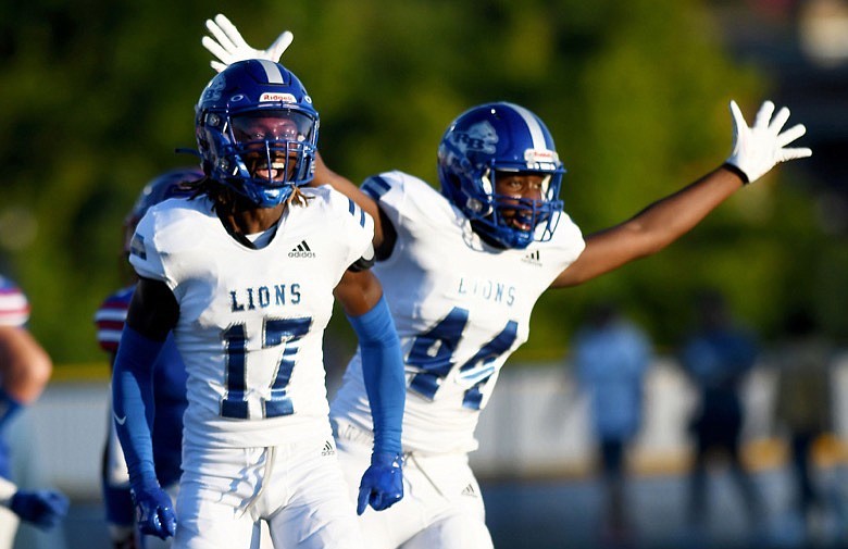 Staff Photo by Robin Rudd / Red Bank's Daune Morris (17) and Jordan Shaw (44) celebrates as the Lions recover a Cleveland fumble.  The Red Bank Lions visited the Cleveland Blue Raiders, in TSSAA football action, on Thursday night, August 19, 2022.