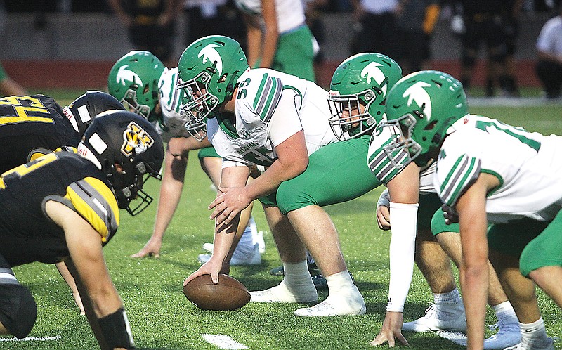 Blair Oaks center Wyatt Bonnett prepares to snap the ball during a game last season at Versailles. Bonnett, one of Blair Oaks’ 10 seniors this season, is a two-time Class 3 all-state offensive linemen. (Greg Jackson/News Tribune)