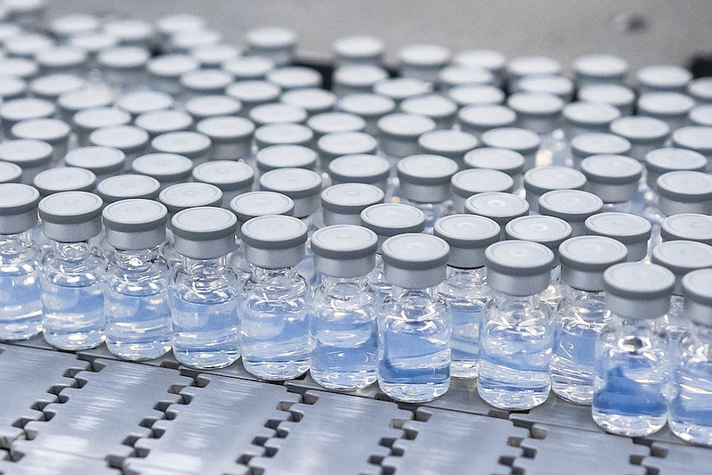 This August 2022 photo provided by Pfizer shows vials of the company's updated COVID-19 vaccine during production in Kalamazoo, Mich. U.S. regulators have authorized updated COVID-19 boosters, the first to directly target today's most common omicron strain. The move on Wednesday, Aug. 13, 2022, by the Food and Drug Administration tweaks the recipe of shots made by Pfizer and rival Moderna that already have saved millions of lives. (Pfizer via AP)