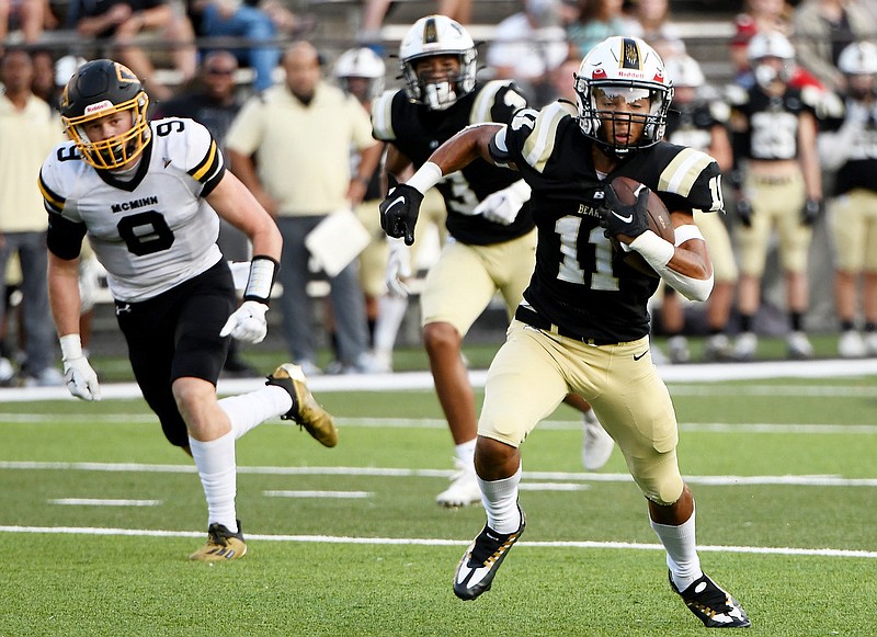 Staff photo by Robin Rudd / Bradley Central’s Jarrius Rogers (11) heads to the end zone for a touchdown catch during Thursday’s home win against McMinn County.