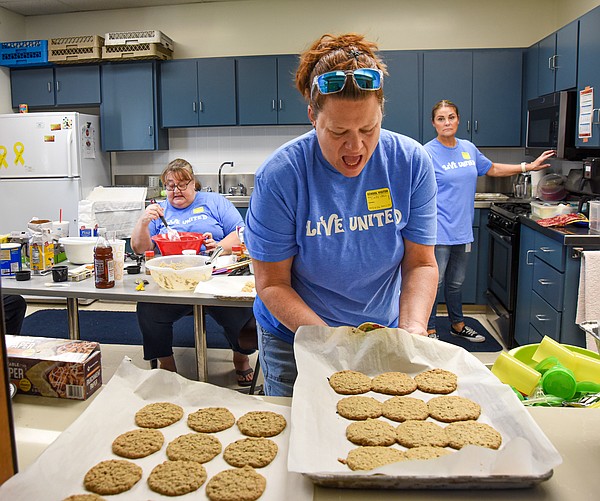 Whether baking cookies or raking yards, volunteers shine during Days of Caring - Vimarsana News