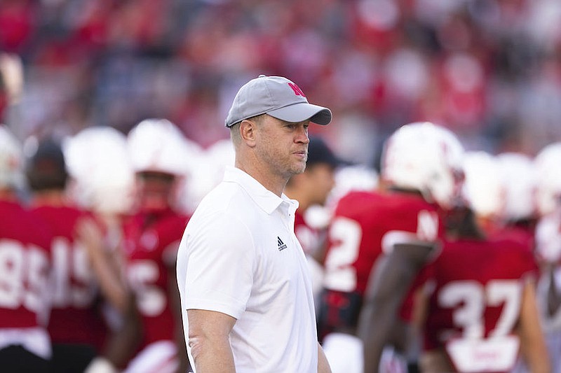 Nebraska head coach Scott Frost walks around with players during warmups before playing against Georgia Southern in an NCAA college football game Saturday, Sept. 10, 2022, in Lincoln, Neb. (AP Photo/Rebecca S. Gratz)